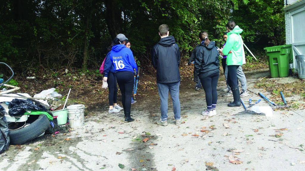 Loyola University students and Friends of Springfield Woods clean up and restore the small, wooded area in Baltimore.