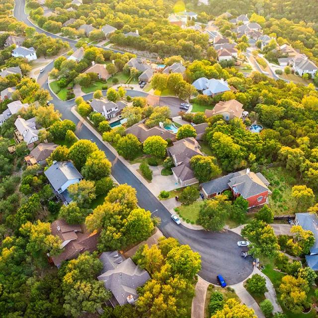 Aerial view of a neighborhood with plenty of trees