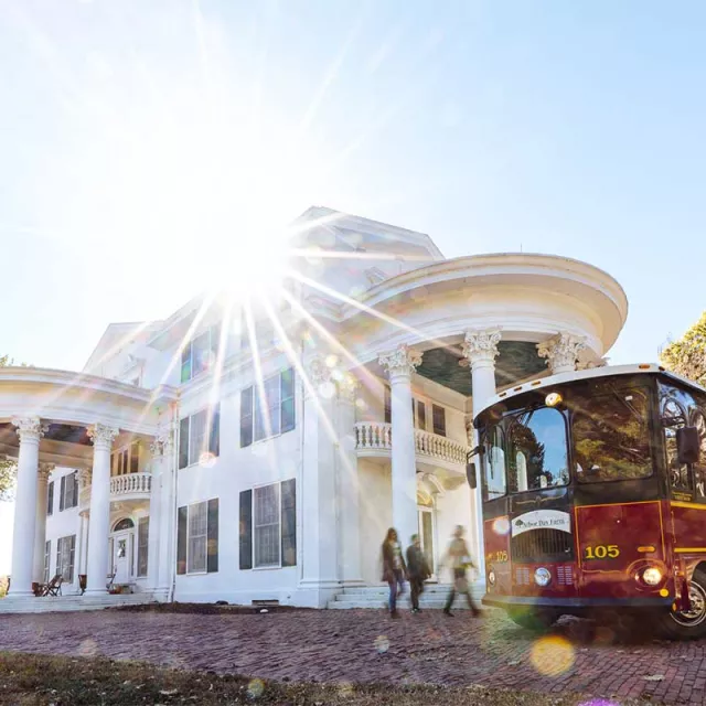 Mansion and trolley at Arbor Day Farm.