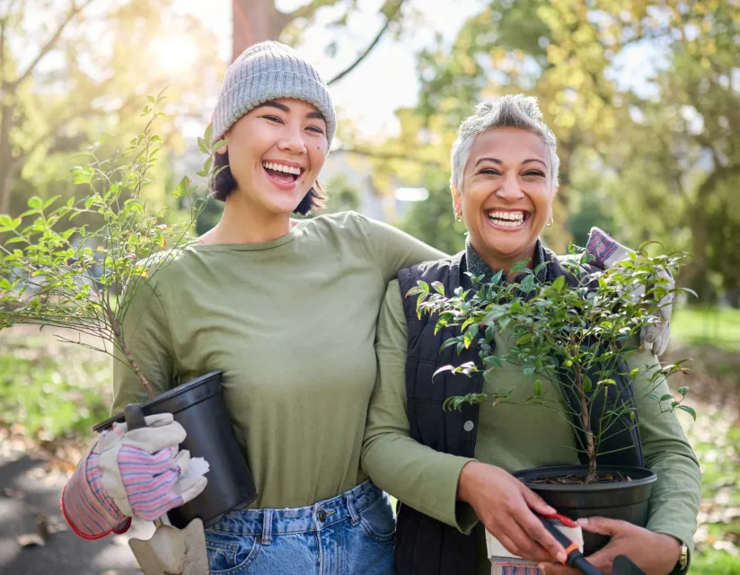 people smiling with trees