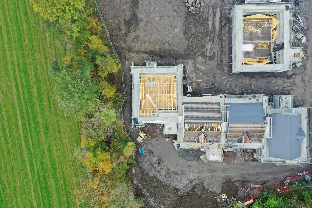 houses being build next to trees