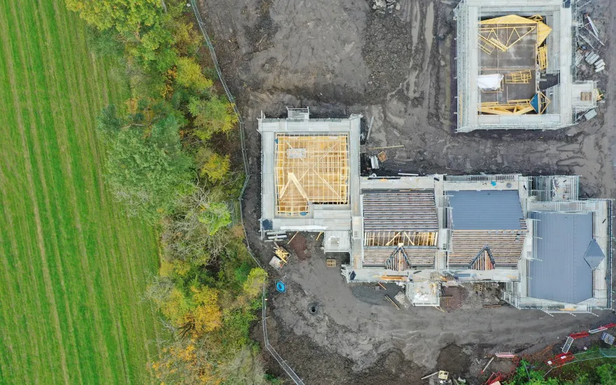 houses being build next to trees