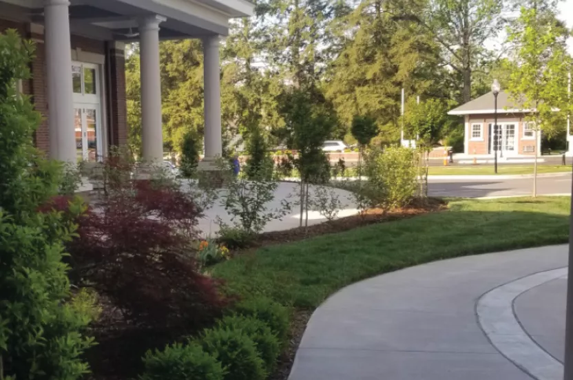 Front entrance of a Masonic Homes Kentucky, Louisville Campus showcasing a well-landscaped exterior.